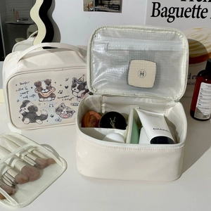 Portable cream toiletry bag with border collie print and organized internal storage