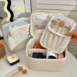 Detail view of large capacity makeup bag with detachable mesh organizer and brush holder