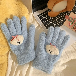 Detail of light blue coral fleece gloves with cute dog embroidery and red bow design