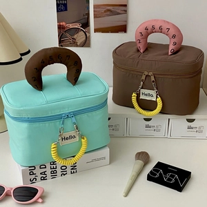 Detail view of large waterproof travel toiletry bags with handles and dual zippers