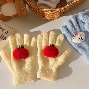 Close-up of soft coral fleece gloves with 3D cartoon apple and bear plush decorations