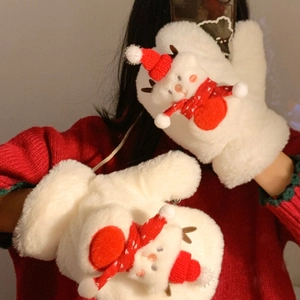 Detail of plush white mittens featuring 3D Christmas snowman decor on red fabric