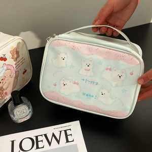 Detailed view of the cute puppy print makeup bag with handle and metal zipper