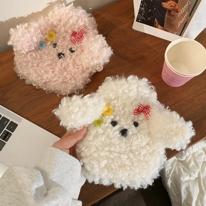 Detail of plush lamb wool puppy warm water bag covers in pink and white with plaid bows