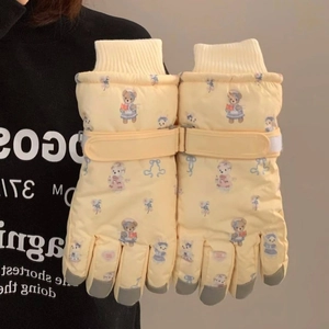 Detail of winter gloves with bear print, adjustable wrist strap and knit windproof cuffs