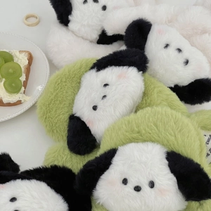 Detailed view of fluffy cartoon puppy plush headband with soft ears and green accents