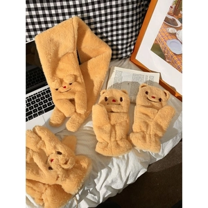 Ginger plush winter set with bear embroidery featuring gloves and scarf on a bed