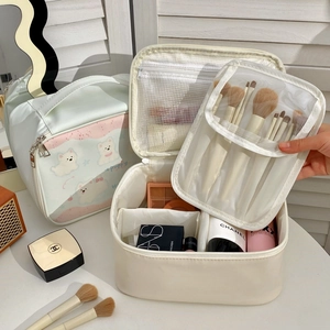 Large capacity waterproof makeup bag with interior partitions and handle for travel use