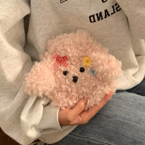 Pink plush poodle hot water bottle cover with cute bow and button details in hand