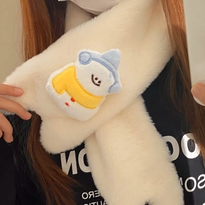 Close-up of white plush scarf featuring cute cartoon snowman embroidery for winter warmth