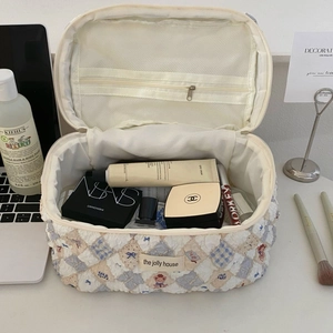 Quilted cream cosmetic bag with cute bear print and large inner storage mesh pocket