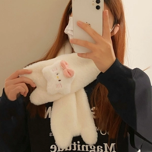 Detail of soft white faux fur scarf with cute 3D cartoon cat character decoration