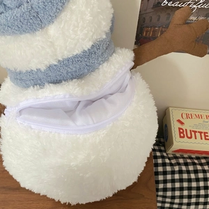 Rechargeable snowman hand warmer with plush striped texture and functional zipper opening