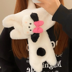 Detail of soft white plush winter scarf with cute cartoon dog ears and pink bow detail