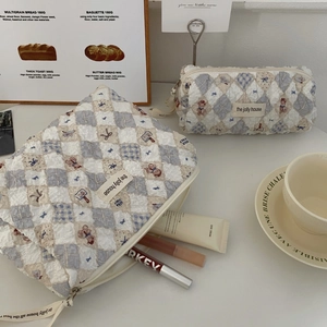 Detailed view of quilted makeup bag set with bear patterns and large storage capacity