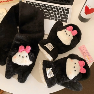 Detail of plush black mittens and scarf with cute puppy design and pink bows