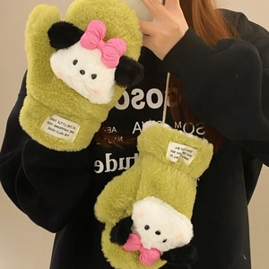 Close-up of green plush puppy mittens with thick faux fur and neck strap for winter