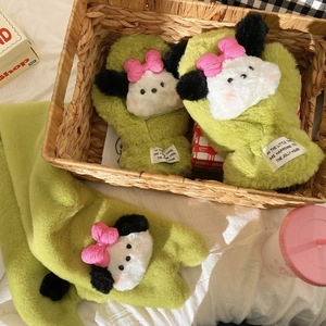 Detail of plush green puppy mittens with pink bow and soft thermal lining for winter