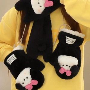 Close-up of plush puppy mittens with thick faux fur and pink bows for winter warmth