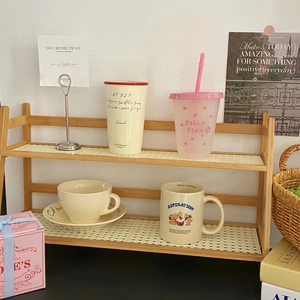 Detail of double-layer cream wooden desktop organizer shelf with mesh partitions