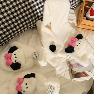Detailed view of warm plush puppy gloves and hooded shawl set in creamy white coral fleece
