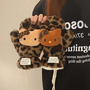 Detail of leopard print plush mittens featuring cute 3D character decor and wrist cord