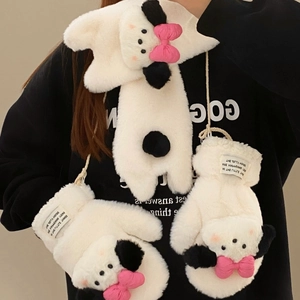 Detail of plush puppy gloves with embroidery, pink bow, and convenient neck lanyard