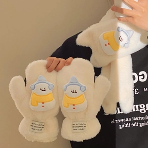Detail of plush white scarf and mittens set featuring cute snowman embroidery for winter