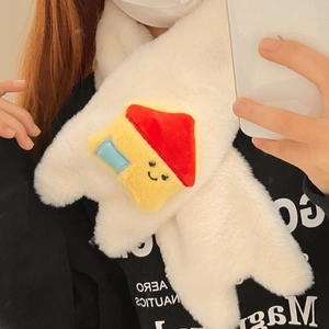 Detail of plush cream faux fur scarf featuring a cute cartoon house patch and cross design