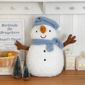 Detailed plush texture of winter snowman hot water bottle with blue knit hat and scarf