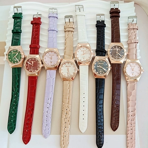Detail shot of multi-color crocodile grain leather straps and rhinestone bezel quartz watches