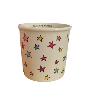 Colorful star ceramic mug with Shine Like The Stars text and hand-drawn star patterns