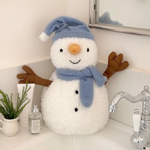 Cute snowman hot water bottle plush with blue knitted hat and scarf on a white vanity