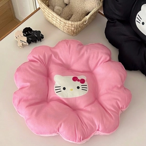 Detail of pink flower-shaped plush seat cushion featuring a cute cartoon cat design