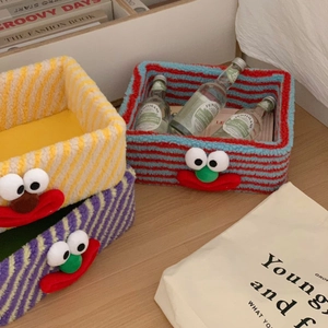 Close-up of lamb wool monster storage baskets for jewelry and cosmetics organization