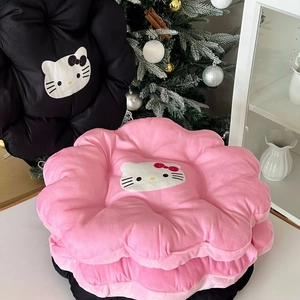 Detail of plush flower-shaped chair cushion featuring a soft pink and black cartoon cat design