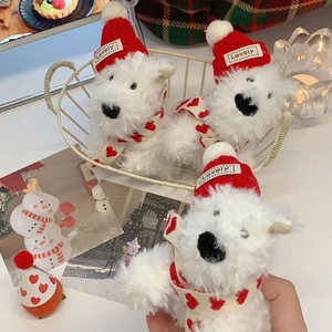 Close-up of West Highland White Terrier plush dolls with Lovely hats and red heart scarves