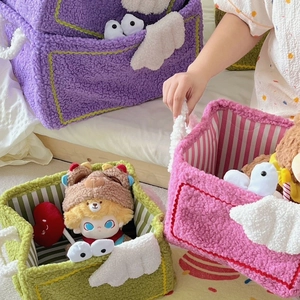 Cute fleece cartoon storage basket with wings and striped lining for toy organization