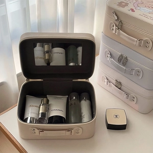Detail view of large capacity PU leather cosmetic box with mirror and elastic straps