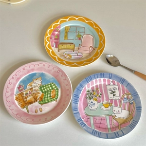 Cute hand-painted ceramic plates with cartoon cat patterns and colorful wavy borders