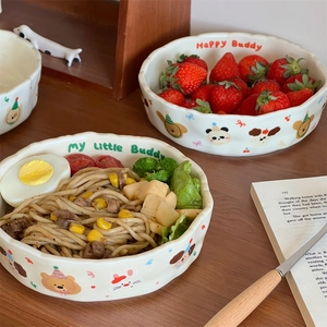 Cream-colored matte ceramic pasta plate with cute hand-painted animals and wavy rim