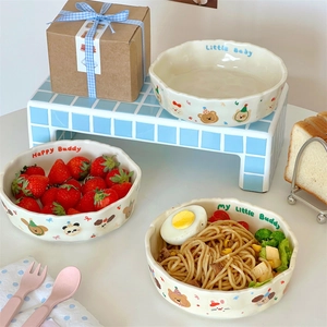 Cute cream ceramic pasta bowl with scalloped edges and hand-drawn animal patterns