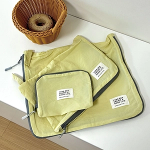 Set of 3 yellow waterproof nylon travel storage bags with zippers for luggage organization