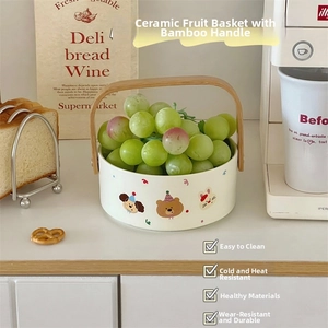 Detail of cute animal ceramic bowl with folding bamboo handle for dessert and snacks