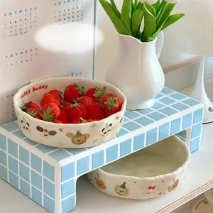 Close-up of cream ceramic bowl with cute panda patterns, oven and air fryer safe