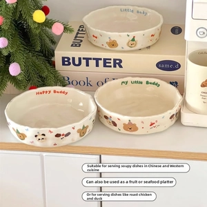 Detail of cream ceramic deep plate with wave edge and cute animal cartoon pattern