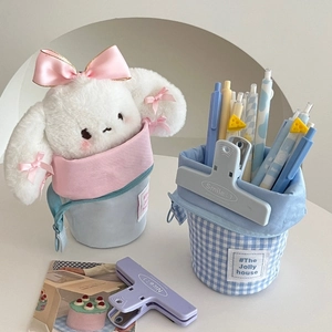 Detail of a pastel pencil case showing its foldable stand-up design and canvas texture