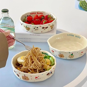 Close-up of cream matte ceramic plate with cute cartoon animals and wavy edges