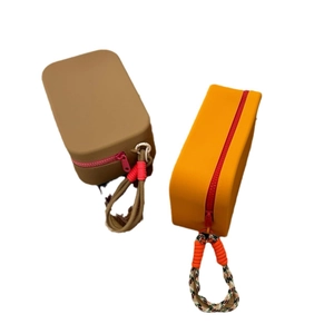 Waterproof silicone cosmetic bags in brown and orange with durable rope handles