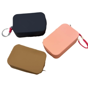 Portable silicone makeup and toiletry storage pouches in navy, orange and yellow tones